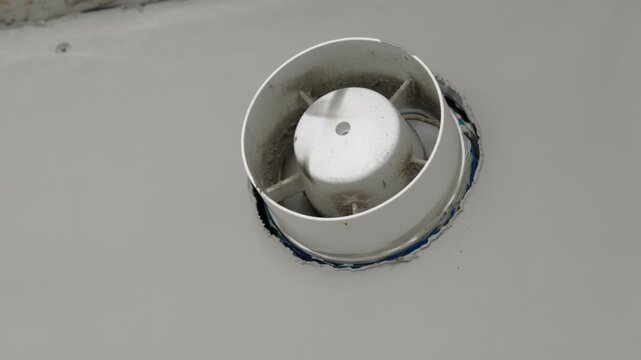 Home vent grille for air purification, circulation. Forced ventilation in wall under ceiling. Bathroom ventilation fan in modern apartment photo. Industrial vents. Square ventilation cap. Vents pipes.