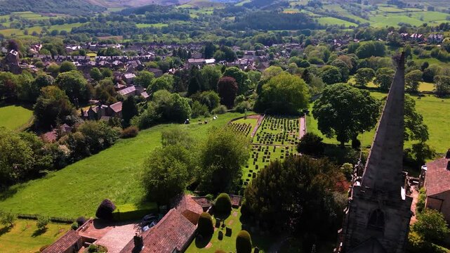 Aerial drone shot revealing Hathersage village from St Michael and All Angels Church spire