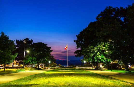 Canadian Flag on Main Mall at University of British Columbia in Vancouver at sunset