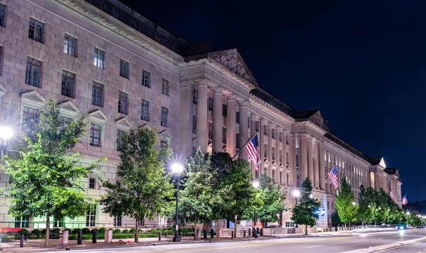 The Herbert C. Hoover Building, U.S. Department of Commerce headquarters, in Washington, D.C. This historic Federal Triangle landmark is illuminated on a clear evening