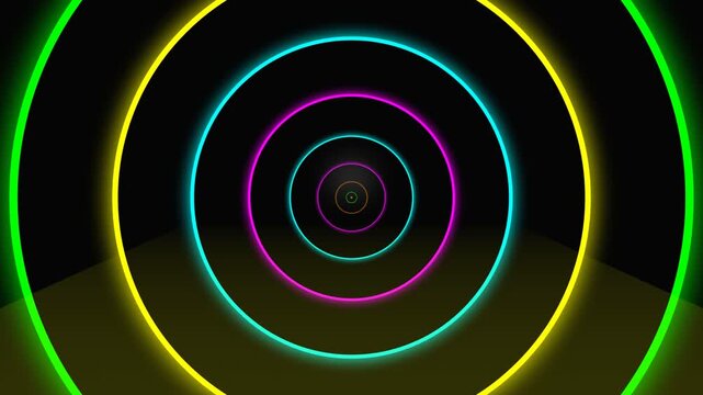 Vibrant neon concentric circles create a hypnotic tunnel effect with glowing rims of green yellow and pink against a dark spacious environment perfect for abstract digital art and immersive