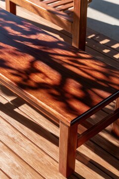 Wooden Bench with Leaf Shadows