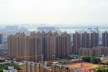 Modern City Overlook with High-Rise Complex and Construction © HoangNgoc