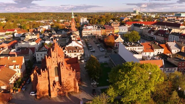 The market square in Starogard Gdanski in the light of the setting sun at autumn. Poland