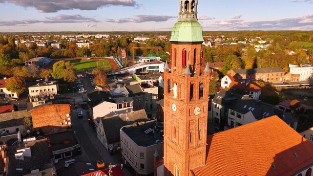 The market square in Starogard Gdanski in the light of the setting sun at autumn. Poland