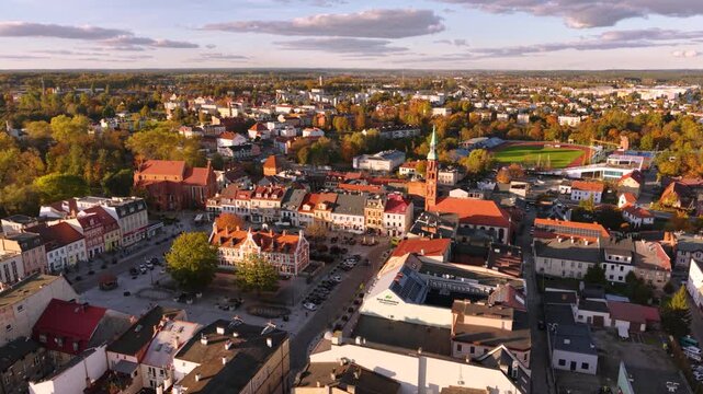 The market square in Starogard Gdanski in the light of the setting sun at autumn. Poland
