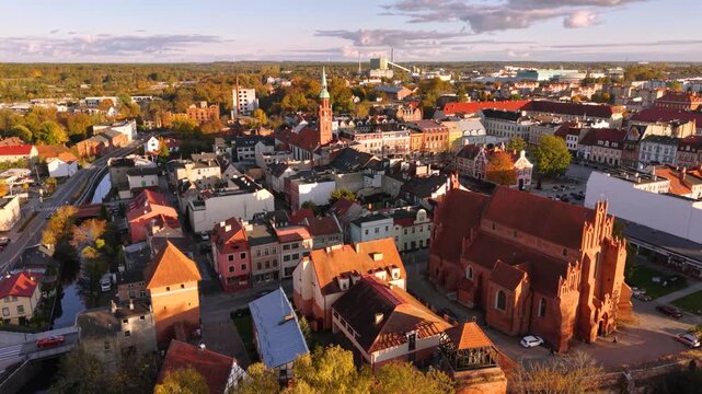 The market square in Starogard Gdanski in the light of the setting sun at autumn. Poland