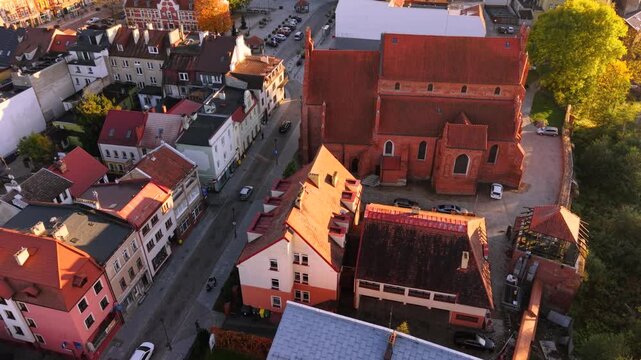 The market square in Starogard Gdanski in the light of the setting sun at autumn. Poland
