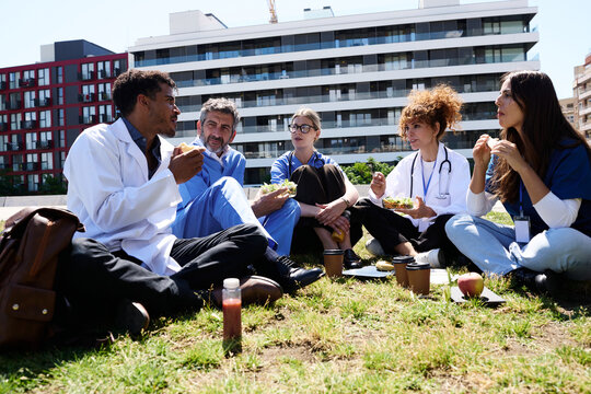 Medical team enjoying healthy lunch break outdoors