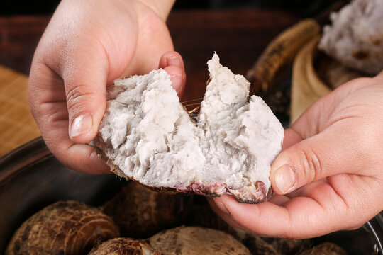 Fresh Taro Root Cut Open Showing White Flesh and Red Skin