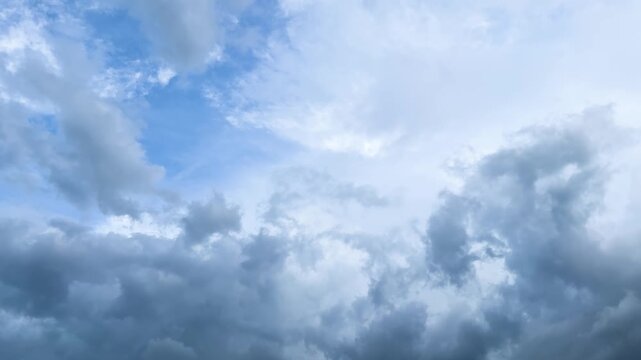 Spectacular thunderclouds on blue sky, gloomy weather background with dark rain clouds