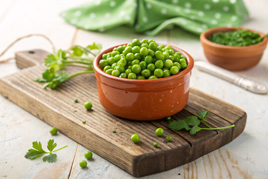 Fresh Green Peas in Rustic Clay Bowl &ndash; Organic Garden Peas on Wooden Board Healthy Food Concept