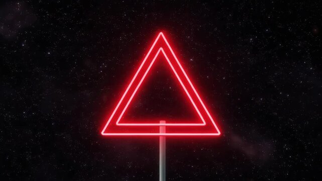 Red neon triangle atop a pole against a starry night sky