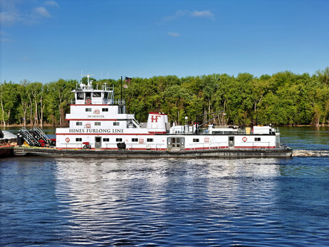 Savanna, Illinois - April 25, 2026; J.W. Hunter tug boat pushing a set of cargo barges South down the Mississippi River