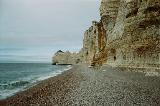 White Chalk Cliffs and Pebble Beach in &Eacute;tretat, Normandy, France
