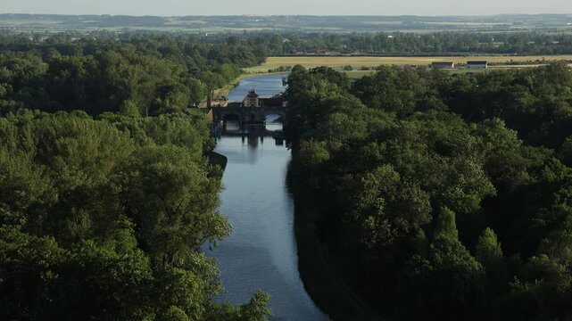 Scenic view of the confluence of the Vltava and Elbe (Labe) rivers near Měln&iacute;k Castle in the Czech Republic. Beautiful Central European landscape with flowing waterways, green riverbanks, historic sur