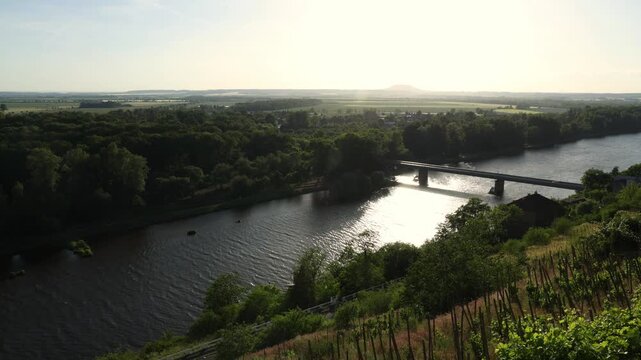 Scenic view of the confluence of the Vltava and Elbe (Labe) rivers near Měln&iacute;k Castle in the Czech Republic. Beautiful Central European landscape with flowing waterways, green riverbanks, historic sur