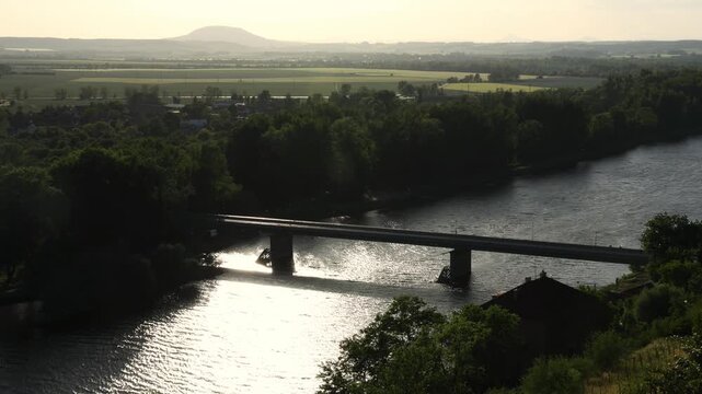 Scenic view of the confluence of the Vltava and Elbe (Labe) rivers near Měln&iacute;k Castle in the Czech Republic. Beautiful Central European landscape with flowing waterways, green riverbanks, historic sur