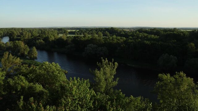Scenic view of the confluence of the Vltava and Elbe (Labe) rivers near Měln&iacute;k Castle in the Czech Republic. Beautiful Central European landscape with flowing waterways, green riverbanks, historic sur