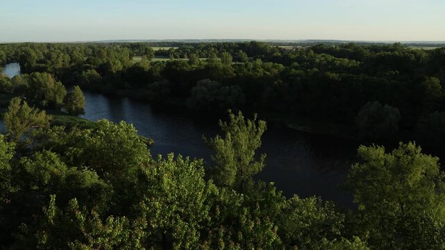 Scenic view of the confluence of the Vltava and Elbe (Labe) rivers near Měln&iacute;k Castle in the Czech Republic. Beautiful Central European landscape with flowing waterways, green riverbanks, historic sur