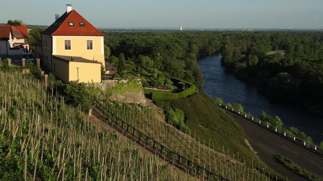 Scenic exterior view of Měln&iacute;k Castle in the Czech Republic, overlooking the confluence of the Vltava and Elbe (Labe) rivers. Historic hilltop castle surrounded by vineyards and panoramic Central Euro