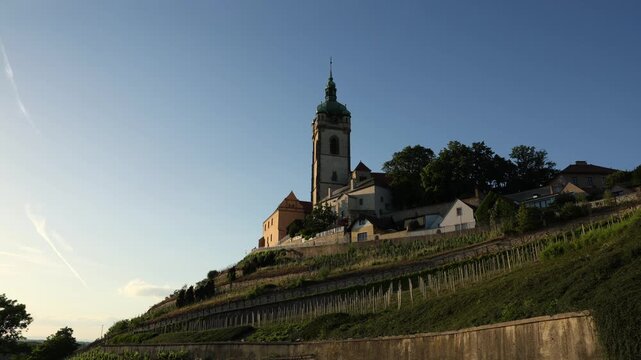 Scenic exterior view of Měln&iacute;k Castle in the Czech Republic, overlooking the confluence of the Vltava and Elbe (Labe) rivers. Historic hilltop castle surrounded by vineyards and panoramic Central Euro