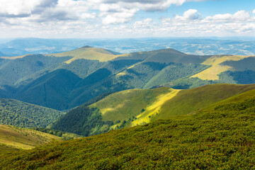 Naklejka premium beautiful mountain landscape in summer. travel ukraine background. rolling hill in dappled light. scenic view of borzhava ridge. carpathian mountain scenery