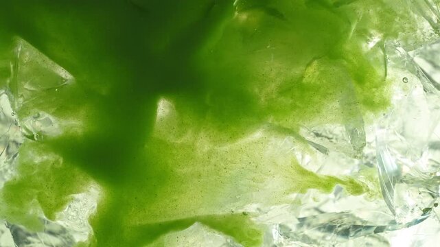 Pour of Matcha Into Water with Ice Cubes , Super Slow Motion