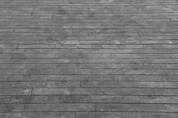 Fototapeta premium empty stone floor top in perspective. grey tile floor background in perspective view. line. empty copy space stone street. pavement. Granite outdoor tiled floor. gray granite. Marble texture