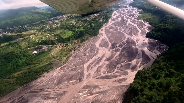 Aerial View of Wide Braided River and Tropical Forest from Small Airplane, Ecuadorian Rainforest Landscape, Remote Wilderness, Aviation Travel and Nature Exploration