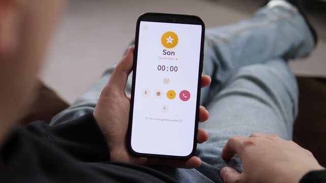 Tapping to call a contact labeled Son on a smartphone. The screen displays a yellow star icon and a Tap to call button. Perfect for family communication apps, parenting visuals, and personal contact