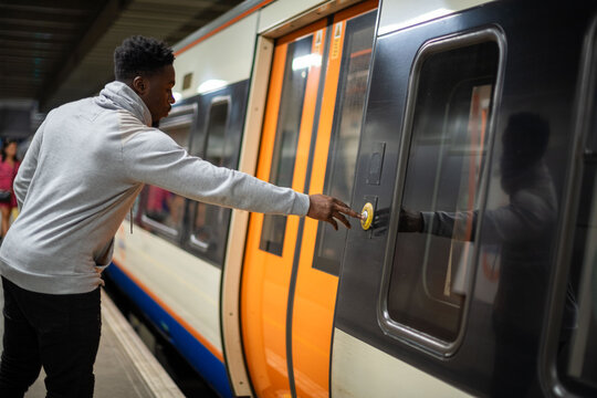 Man boarding modern train platform.