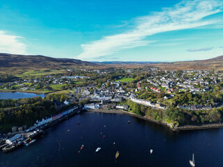 Fototapeta premium Aerial View of Portree Harbour and Colourful Waterfront Buildings, Isle of Skye, Scottish Highlands, Scotland