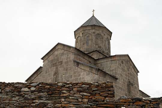The Gergeti Trinity Church is a stunning 14th-century Georgian Orthodox church perched on a 2,170-meter 
