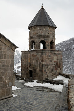 The Gergeti Trinity Church is a stunning 14th-century Georgian Orthodox church perched on a 2,170-meter 