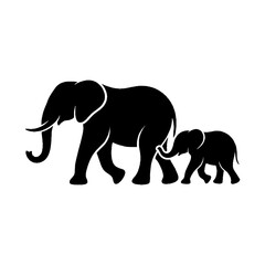 Fototapeta premium Silhouette of a mother elephant walking with her baby calf.