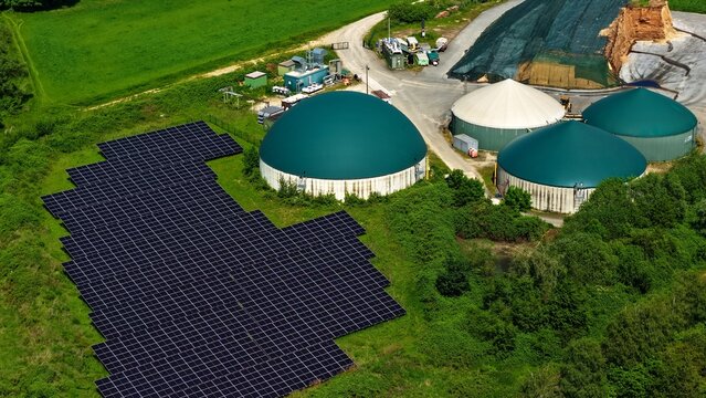 Aerial View of Solar Farm and Biogas Domes in Green Landscape Germany
