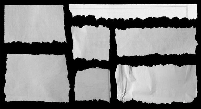 Torn papers on black