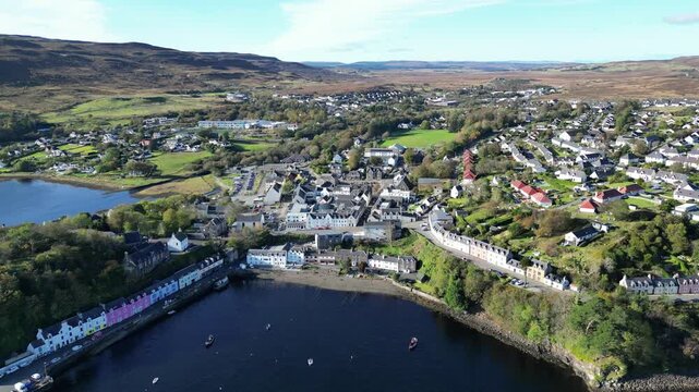 4K Aerial Flying Away from Portree Harbour and Colourful Waterfront Buildings, Isle of Skye, Scottish Highlands, Scotland