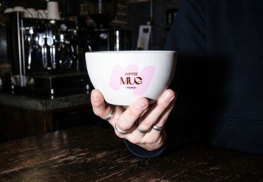 Ceramic Bowl Mug Mockup Held In Hands At Cafe Interior