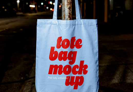 Canvas Tote Bag Mockup Hanging On Urban Pole At Night