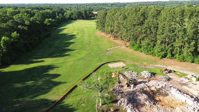Aerial view of building demolition on Dix Park in Raleigh, North Carolina as part of the on-going park enhancement project