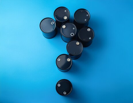 small black barrels forming question mark on blue surface fluctuating oil market petroleum resource scarcity global inflation impact