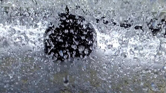 Close Up of Water Splashing and Spraying Inside Industrial Cooling Tower