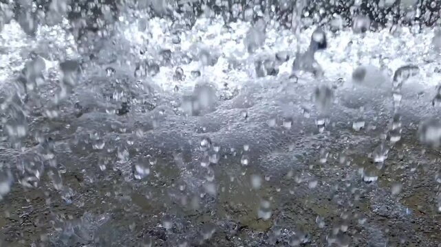 Close Up of Water Splashing and Spraying Inside Industrial Cooling Tower
