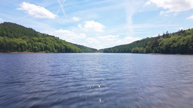Ultra Low Drone Flight Over Derwent Reservoir Water Surface with Forest Reflections, Peak District, England