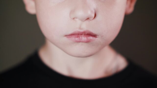 Emotional face of a boy, expression of different emotions