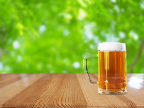 Beer glass on the green meadow