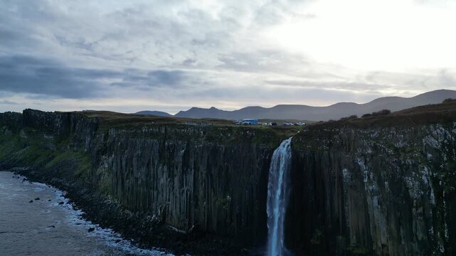 4K Video Aerial Drone Shot Flying Low Underneath Kilt Rock Waterfall &ndash; Creag An Fh&egrave;ilidh, Isle of Skye, Scotland