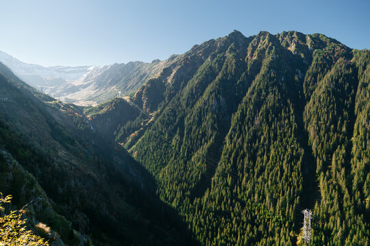 Wide mountain view with Balea Waterfall and cable car lines in Fagaras Mountains, Romania. Transfagarasan Highway. Travel concept